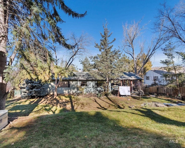 view of yard featuring fence