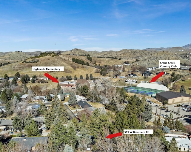 birds eye view of property featuring a mountain view