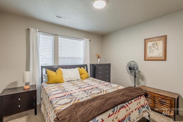 bedroom with carpet flooring and visible vents