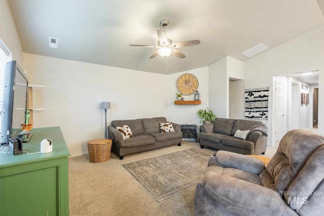 living room with light colored carpet, lofted ceiling, ceiling fan, and visible vents