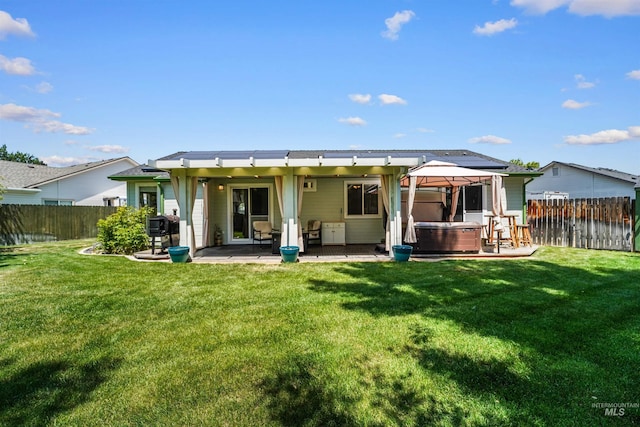 13725 W Fig St, Boise, ID 83713 - rear view of house with a hot tub, a patio, and a gazebo
