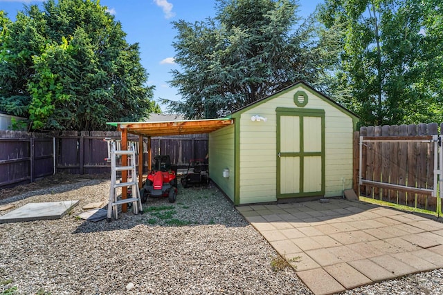13725 W Fig St, Boise, ID 83713 - view of shed with a fenced backyard and a carport