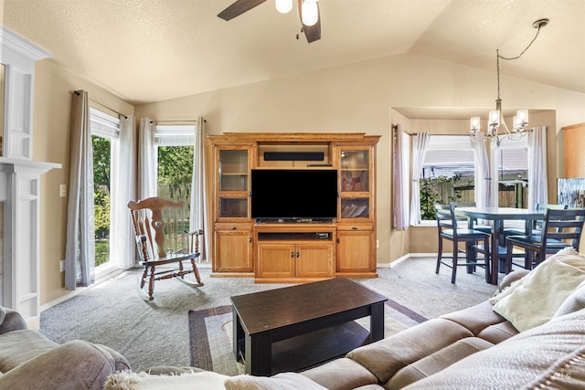 13725 W Fig St, Boise, ID 83713 - living area with carpet, vaulted ceiling, ceiling fan, a chandelier, and baseboards