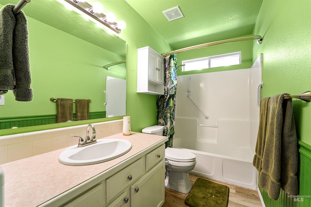 13725 W Fig St, Boise, ID 83713 - bathroom with vanity, wood finished floors, toilet, and shower / bath combo