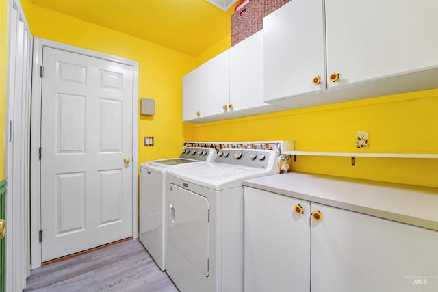 13725 W Fig St, Boise, ID 83713 - washroom featuring cabinet space, washer and clothes dryer, and light wood finished floors