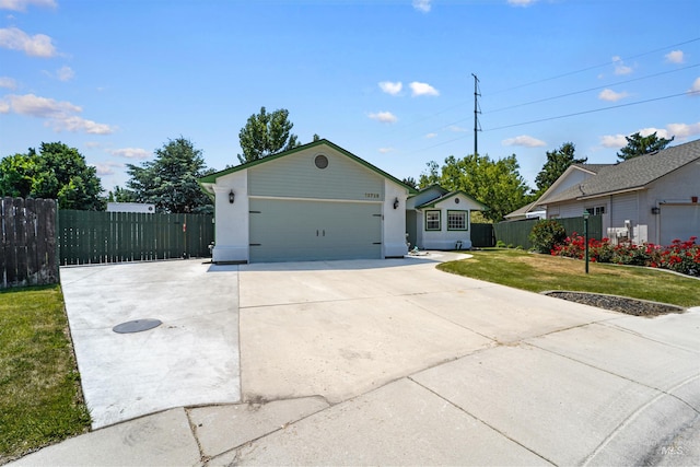 13725 W Fig St, Boise, ID 83713 - ranch-style house featuring concrete driveway and an attached garage