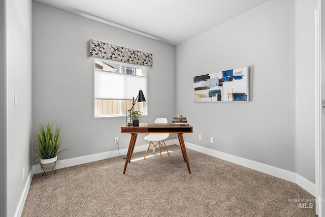 carpeted home office with baseboards