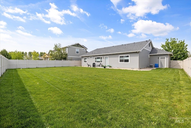 back of property with a patio area, roof with shingles, and central air condition unit