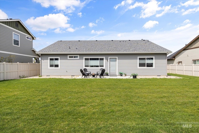 rear view of property featuring a patio, roof with shingles, and crawl space