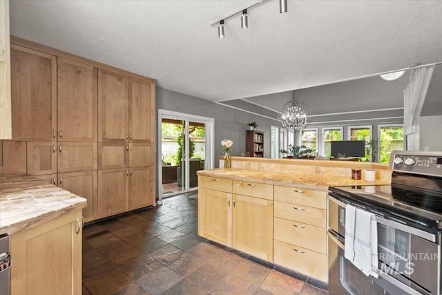 kitchen with pendant lighting, double oven range, light brown cabinetry, and a chandelier