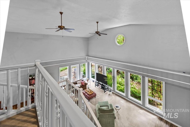 living room featuring lofted ceiling