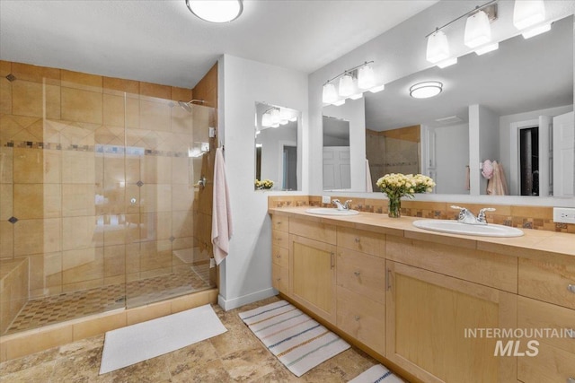 bathroom with vanity and walk in shower