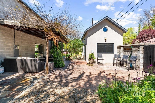 exterior space with outdoor lounge area and a patio