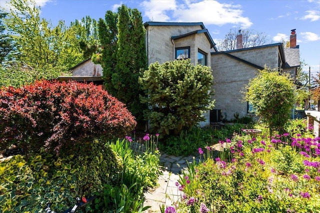 view of home's exterior with cooling unit
