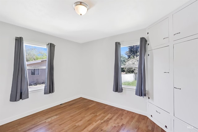 116 6th Ave E, Jerome, ID 83338 - unfurnished bedroom featuring light wood-type flooring and baseboards