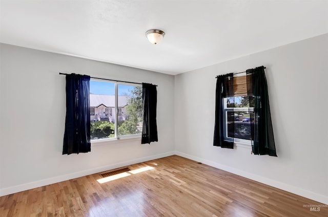 116 6th Ave E, Jerome, ID 83338 - spare room with wood finished floors and baseboards