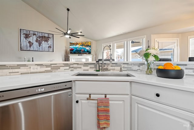 kitchen featuring white cabinets, dishwasher, backsplash, and a sink