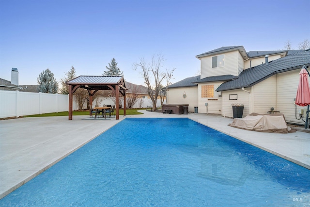 view of swimming pool with a fenced in pool, a hot tub, a gazebo, a patio area, and a fenced backyard