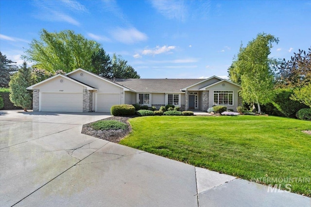 ranch-style house featuring a garage, concrete driveway, a front lawn, and stone siding