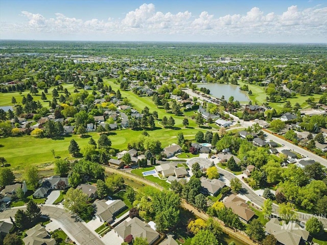 aerial perspective of suburban area with a large body of water and a local golf course