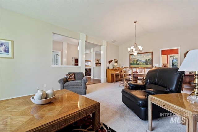 living room with a chandelier, carpet, lofted ceiling, and baseboards