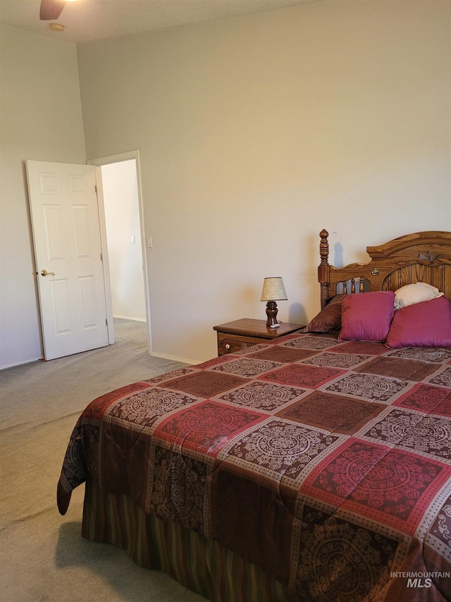 bedroom with a towering ceiling and carpet