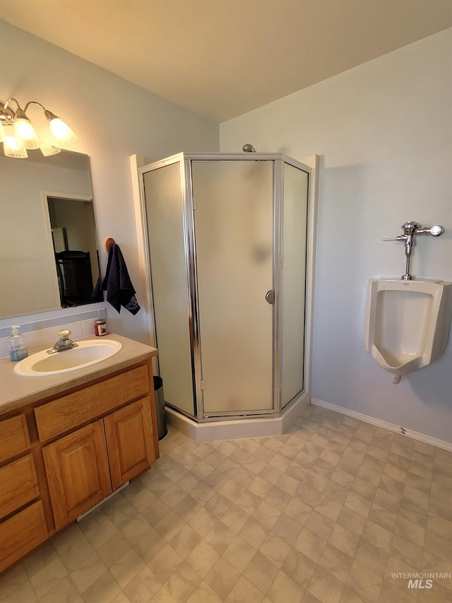 bathroom with vanity and an enclosed shower