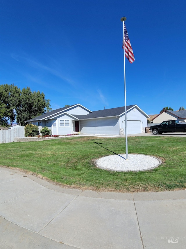 exterior space featuring a front yard and a garage