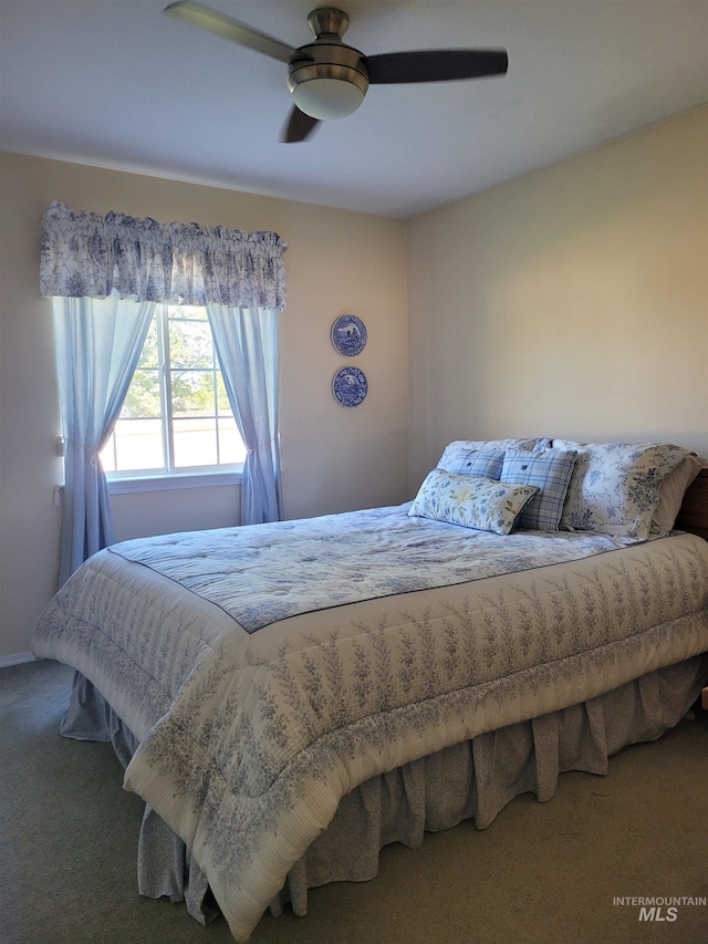 bedroom featuring ceiling fan and carpet floors