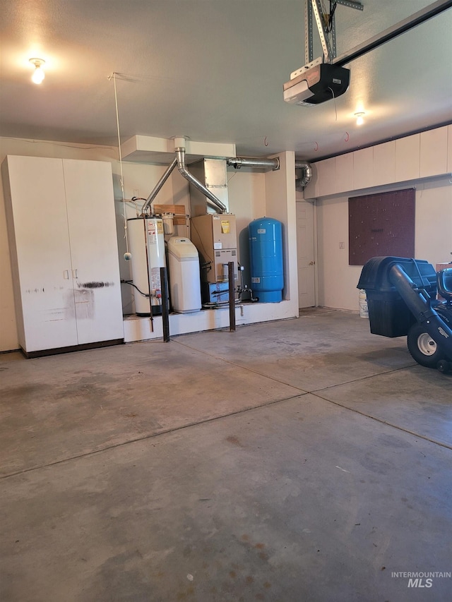 garage with a garage door opener and gas water heater