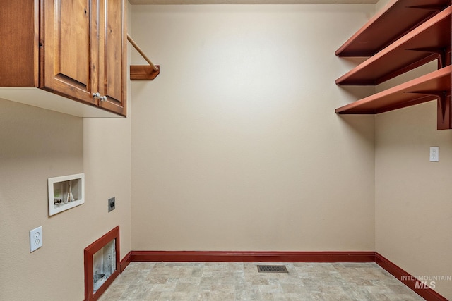 clothes washing area featuring baseboards, visible vents, cabinet space, electric dryer hookup, and washer hookup