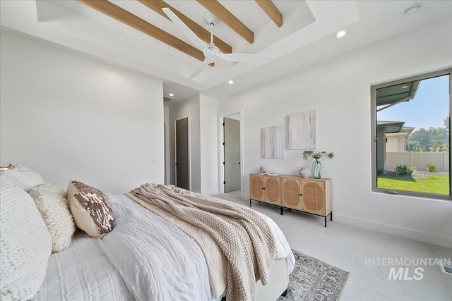 carpeted bedroom with beamed ceiling and ceiling fan