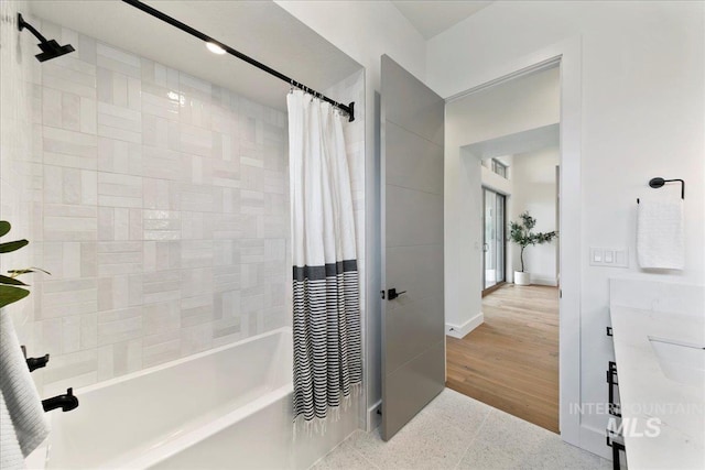 bathroom featuring shower / tub combo with curtain