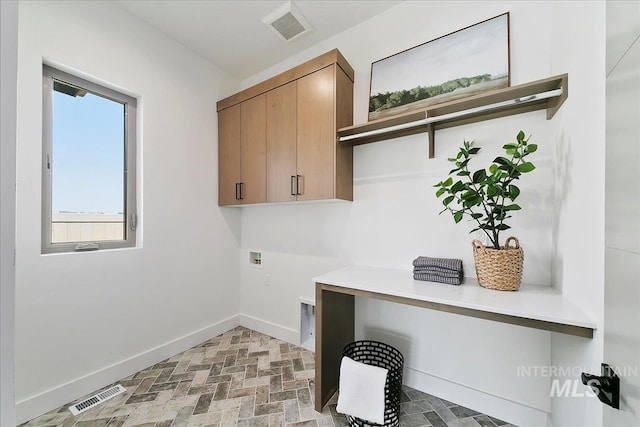 laundry area featuring cabinets and washer hookup