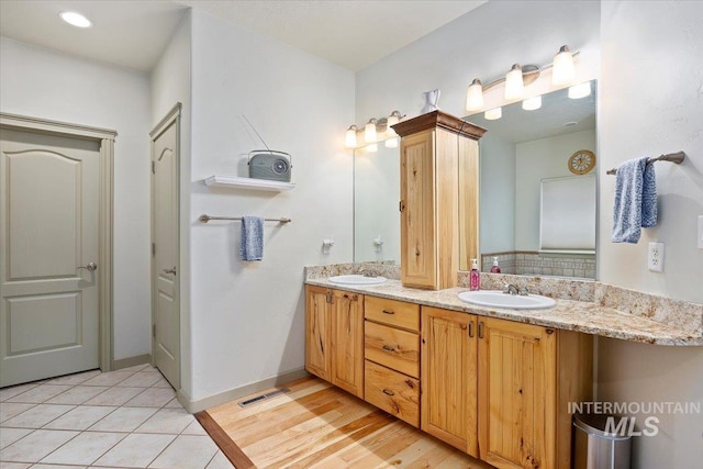 bathroom featuring tile patterned floors and vanity