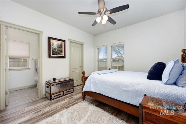 bedroom with connected bathroom, ceiling fan, and light hardwood / wood-style floors