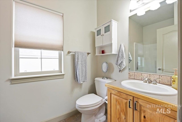 bathroom featuring tile patterned flooring, a shower, vanity, and toilet