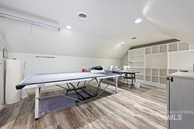 rec room featuring lofted ceiling and wood-type flooring