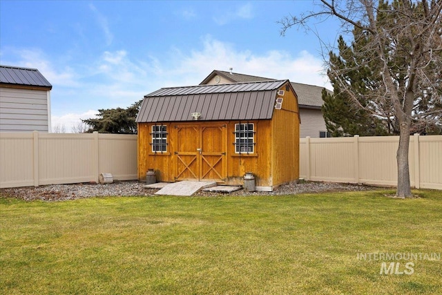 view of outbuilding with a lawn