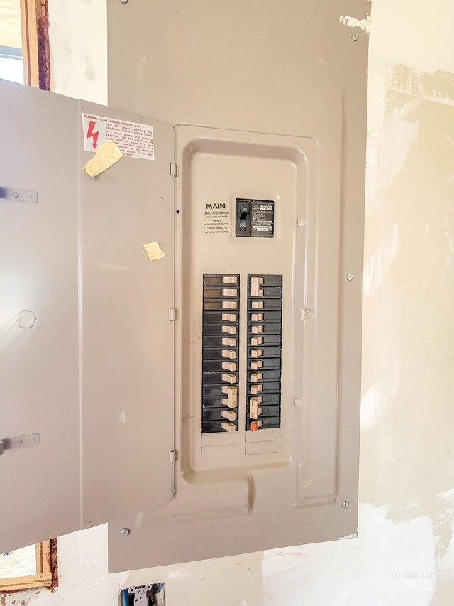 utility room featuring electric panel