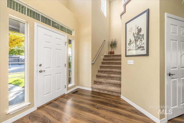 entrance foyer with dark hardwood / wood-style flooring