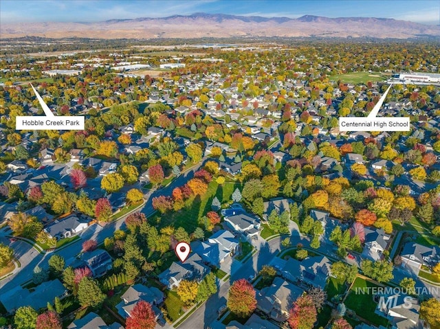 birds eye view of property featuring a mountain view