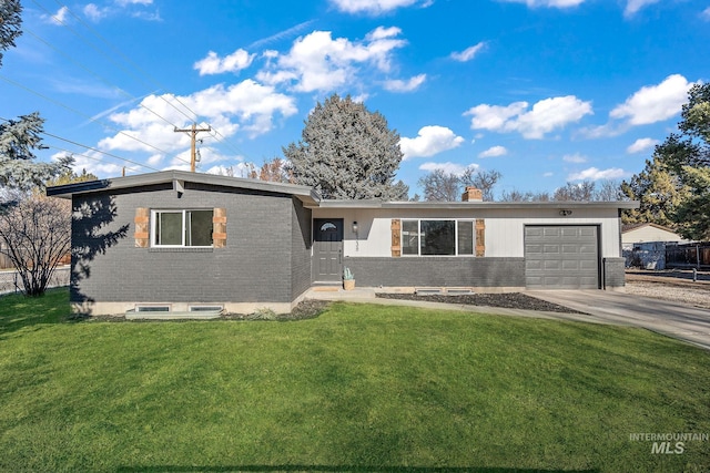 5338 W Spaulding St, Boise, ID 83705 - view of front of house featuring a garage, concrete driveway, brick siding, and a chimney