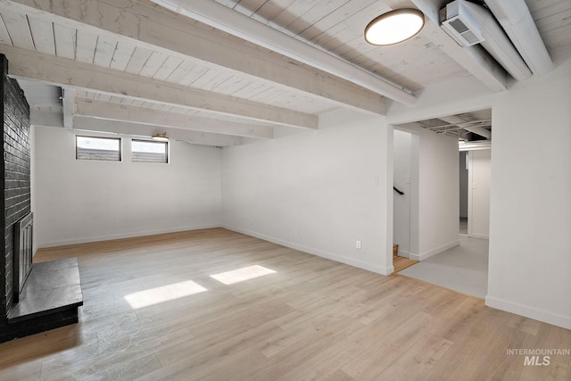 5338 W Spaulding St, Boise, ID 83705 - basement with wooden ceiling, light wood finished floors, baseboards, stairway, and a brick fireplace