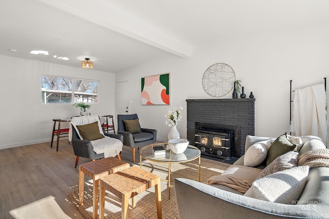 5338 W Spaulding St, Boise, ID 83705 - living room with wood finished floors, beamed ceiling, baseboards, and a brick fireplace
