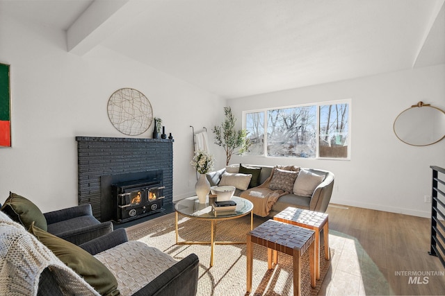 5338 W Spaulding St, Boise, ID 83705 - living area with a brick fireplace, wood finished floors, and baseboards