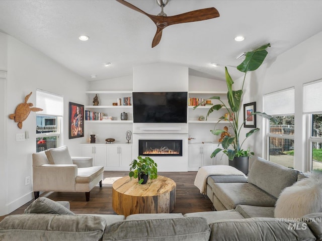 2510 N 24th St, Boise, ID 83702 - living room featuring lofted ceiling, ceiling fan, a glass covered fireplace, dark wood-style floors, and recessed lighting