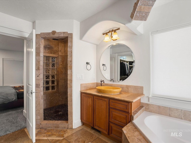 2510 N 24th St, Boise, ID 83702 - ensuite bathroom with tiled shower, a garden tub, vanity, and a walk in closet