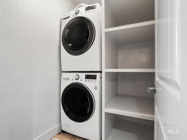 2510 N 24th St, Boise, ID 83702 - laundry area featuring stacked washing machine and dryer and a textured wall