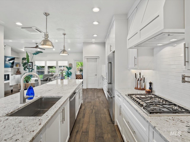 2510 N 24th St, Boise, ID 83702 - kitchen with stainless steel appliances, premium range hood, recessed lighting, and white cabinetry